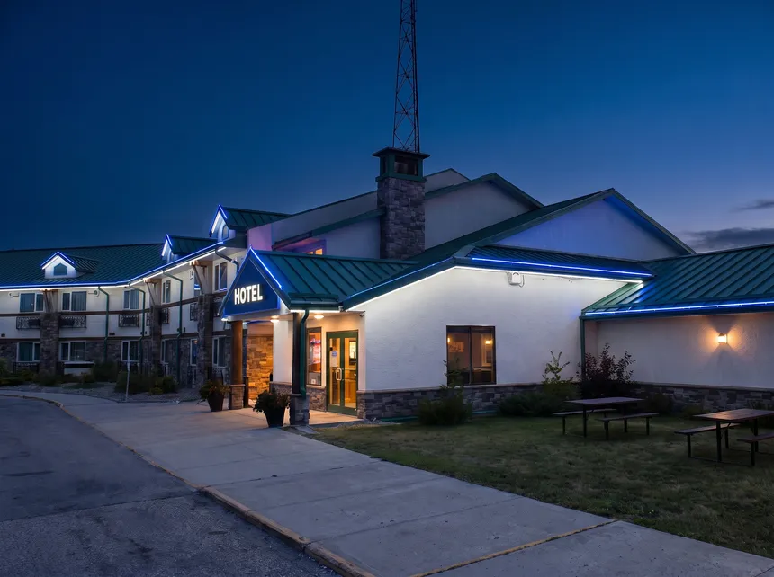 Bear Claw hotel wing at dusk with lit windows